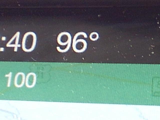 Image showing a digital display with the time reading 2:40 and a temperature of 96°F. The background color is green. Percy Warner Mountain Bike Trails mountain bike trail.