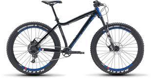 Diamondback Mason 2: A black mountain bike with blue accents, featuring wide tires and a sturdy frame, suitable for off-road cycling.