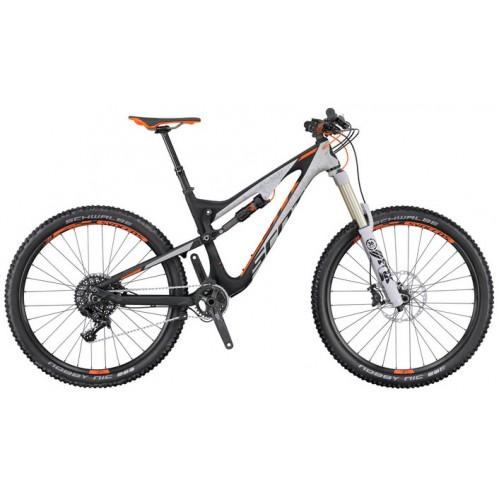 A modern mountain bike featuring a lightweight frame in black and white with orange accents, large wheels, and front suspension designed for off-road riding.