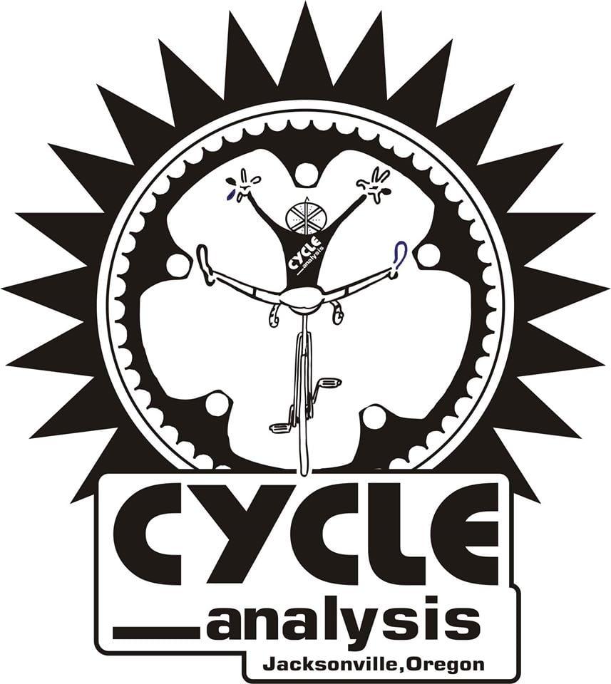 Black and white graphic logo featuring a stylized cyclist performing a trick on a bicycle, with the words "CYCLE analysis" prominently displayed below. The design is framed by a circular gear motif and a sunburst pattern, and includes "Jacksonville, Oregon" at the bottom.