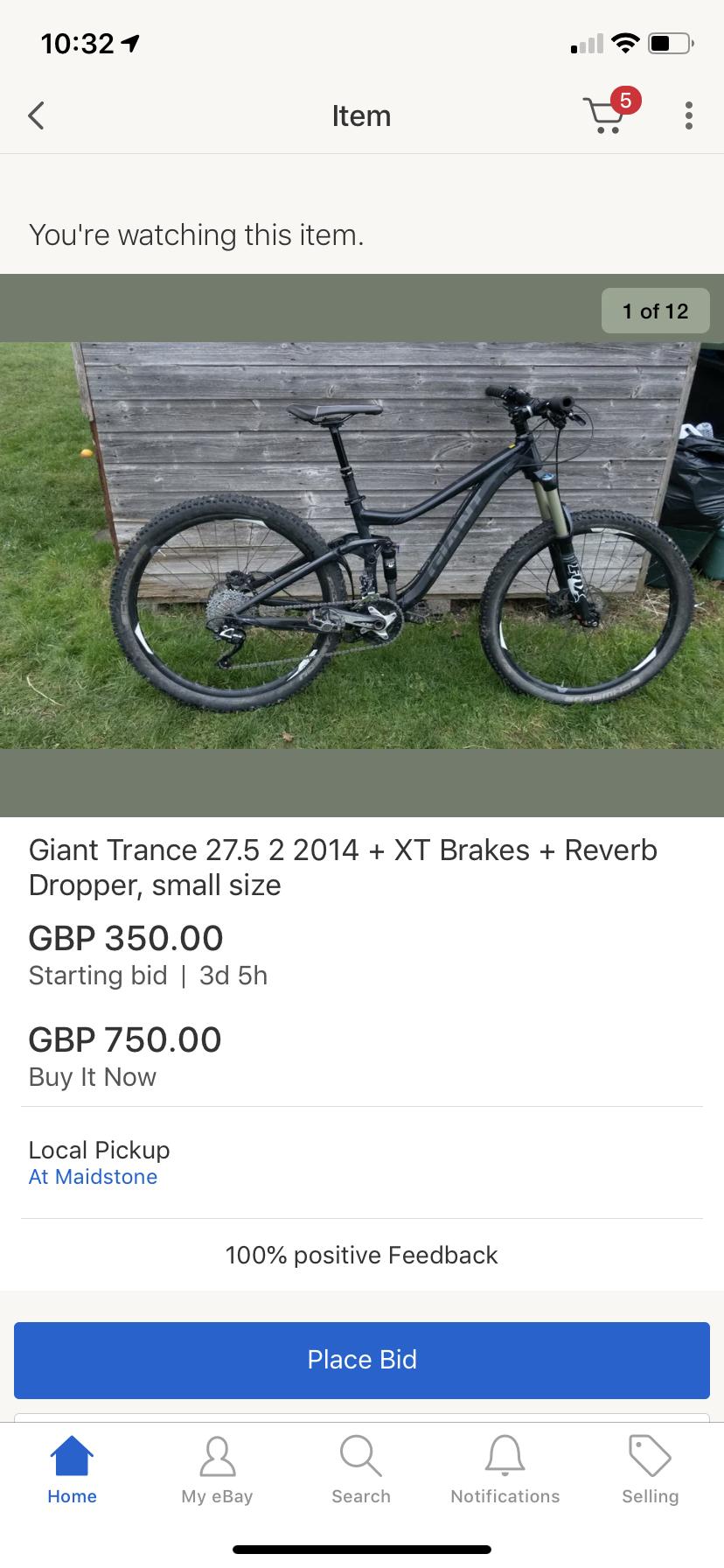 Giant Giant Trance 27.5 2: A black Giant Trance 27.5 bicycle with XT brakes and a Reverb dropper seat post, displayed outdoors on grass with a wooden shed in the background. The image is part of an online auction listing, showing a starting bid price of GBP 350.00, a "Buy It Now" price of GBP 750.00, and is available for local pickup at Maidstone.