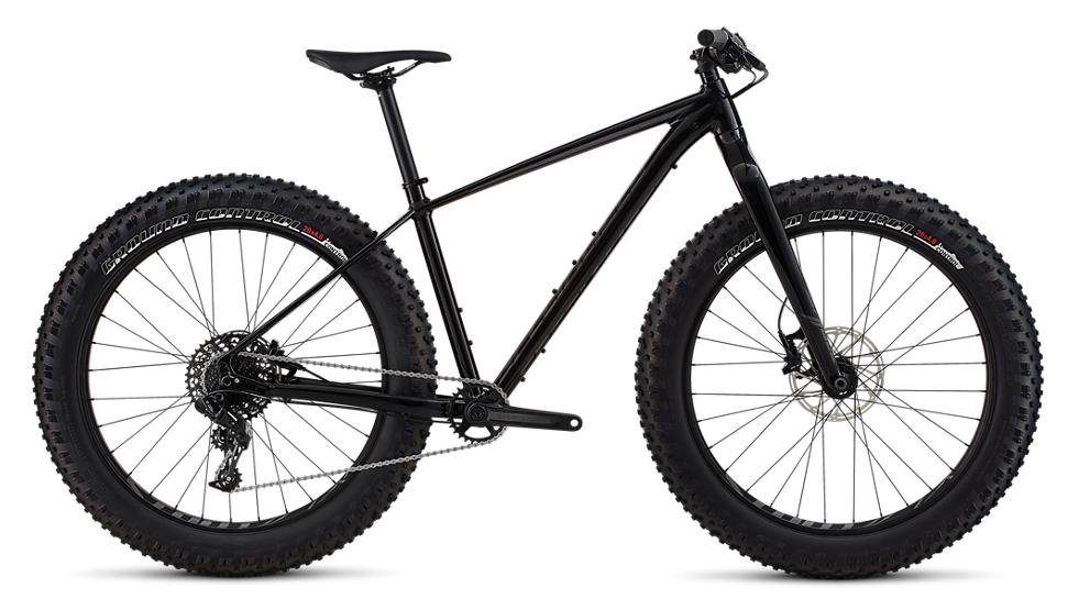 Specialized Fatboy: Alt tag: A black fat bike with oversized tires, featuring a simple frame design and disc brakes, positioned against a plain background.