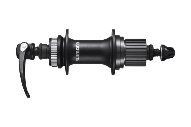 A Shimano bicycle hub, featuring a black metallic finish, a quick-release lever on one side, and a threaded end on the opposite side for securing spokes.