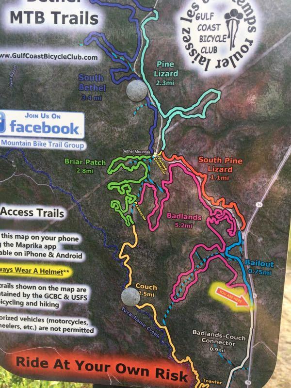 Map of the South Bethel MTB Trails, featuring various biking routes including Pine Lizard, South Bethel, and Briar Patch. Each trail is color-coded with distance markers, and includes safety information advising riders to wear helmets. The map also suggests accessing it via the Maprika app on mobile devices and notes that non-bicycle vehicles are not permitted. Bethel Bike Trails mountain bike trail.