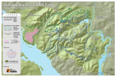 Map of the Standing Boy Creek Wildlife Management Area, detailing the phased construction of hiking trails as of May 17, 2019. The map indicates different trail segments, difficulty levels (beginner, intermediate, advanced), and features such as existing trails, vehicle access points, and notable sites like Dove Field. A legend is provided for clarity. Standing Boy Trails mountain bike trail.