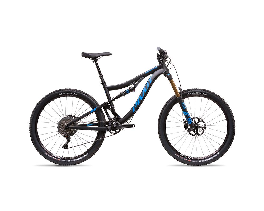 Pivot Mach 6: Mountain bike with a black and blue frame, featuring front suspension, wide tires, and a derailleur system, positioned on a white background.