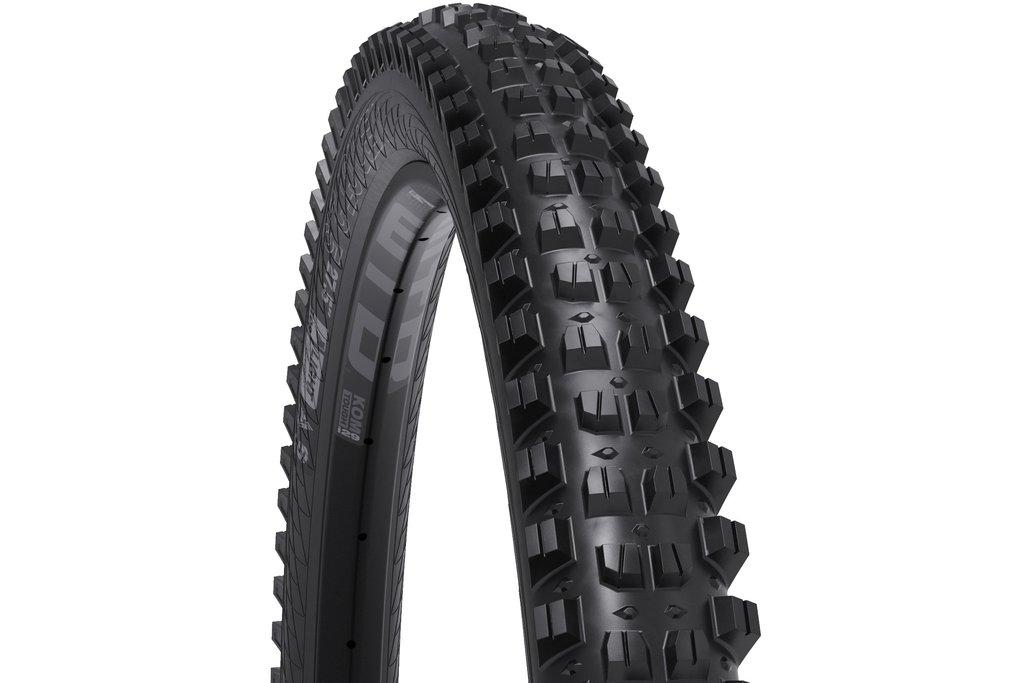 WTB Verdict: A close-up image of a black mountain bike tire featuring prominent, aggressive tread patterns designed for enhanced traction on rough terrain. The tire displays sidewall markings indicating its specifications and brand.