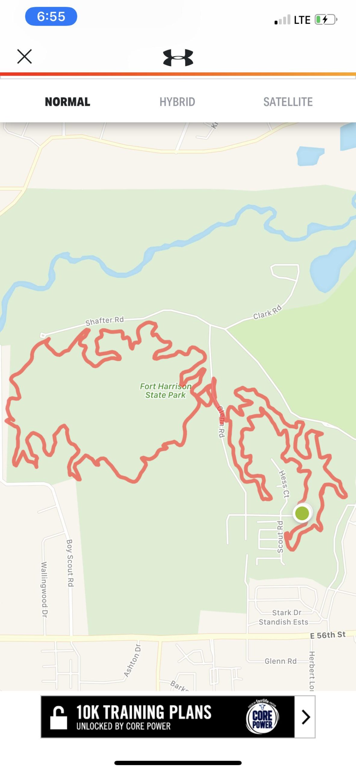 Map of Fort Harrison State Park showing a winding trail highlighted in red. The map also displays nearby roads and features like rivers and parks, with navigation options at the top of the screen. Fort Harrison State Park mountain bike trail.