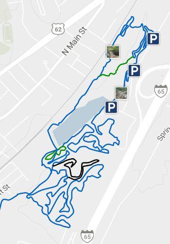 Map showing trails and parking areas in a park, featuring blue and green lines depicting routes. Marked parking spots are indicated with 'P' icons. Buffalo Lake mountain bike trail.