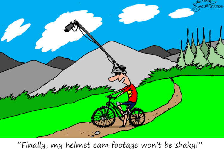Cartoon of a man on a bicycle wearing a helmet. A camera is mounted on a long arm above him, capturing footage as he rides along a dirt trail surrounded by mountains and trees. The caption reads, "Finally, my helmet cam footage won't be shaky!"