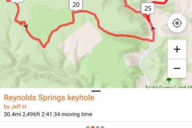Map display showing a route for the "Reynolds Springs keyhole" activity, with details including total distance of 30.4 miles, elevation gain of 2,496 feet, a duration of 2 hours and 54 minutes, and a maximum speed of 35.3 mph. The background shows the Pine Creek Gorge Natural Area with waypoints marked along the route. REYNOLDS SPRING NATURAL AREA - LARIAT mountain bike trail.