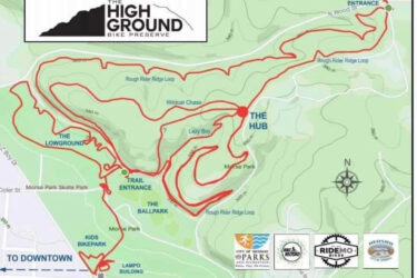 Map of The High Ground Bike Preserve, showing various trails including Rough Rider Ridge Loop, Wildcat Chase, Lazy Boy, and The Lowground. Key features include the trail entrance, The Hub, and nearby parks such as Morse Park and Kids Bike Park. The map indicates distances and provides orientation with a north compass rose. High Ground mountain bike trail.