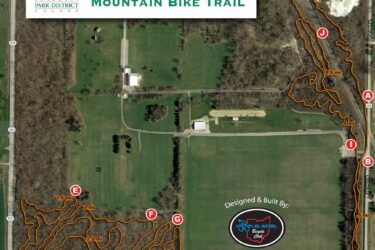 Map of Waggoner's Run Mountain Bike Trail in Sandusky County, featuring various trail routes marked with distances, an overview of the park layout, and designated service/emergency exits. The main trail is 4.7 miles long, with additional segments highlighted in orange. Waggoner's Run Singletrack mountain bike trail.