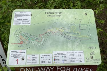 Alt text: Map of Fenton Forest on Bauxite Ridge detailing trails for biking, hiking, and running, with indicated routes, difficulty ratings, and emergency contact information for Southern Adventist University. The map shows locations of parking and trail names. Bauxite Ridge mountain bike trail.