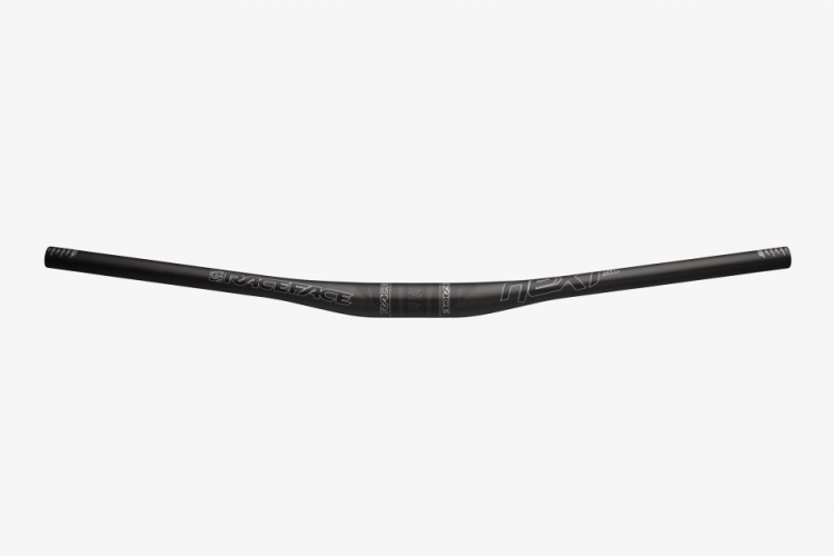 Black bicycle handlebar with a curved design, featuring the "Race Face" logo and the word "Next" printed on it. The ends are tapered, and there are measurement indicators at both ends. The handlebar is designed for mountain biking, emphasizing durability and performance.