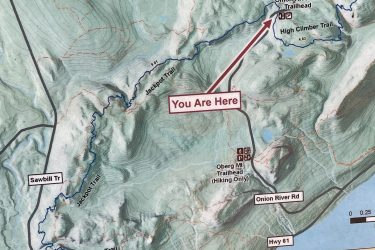 Map of Britton Peak Mountain Bike Trails highlighting various biking routes and trailheads, with a marker indicating "You Are Here." The map includes features like trail names, locations of restrooms and parking, and guidelines for bikers. Jackpot mountain bike trail.