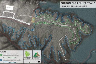 Map of Burton Park Bluff Trails, showing the Phase One corridor design. The map features outlined trails including the Gateway Flow Trail (1.8 miles) and Intermediate Bluff Trail (4.8 miles) in different colors. Key locations are marked with letters, and a scale and orientation indicator are included. Big Branch Bike Park mountain bike trail.