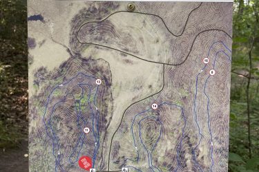 Map of the Lone Lake Park Multi-Use Mountain Bike Trail, featuring marked trails, parking, restrooms, and a bike fix-it station. Includes a legend for trail types and emergency markers, with a "You Are Here" indication. Lone Lake Park mountain bike trail.
