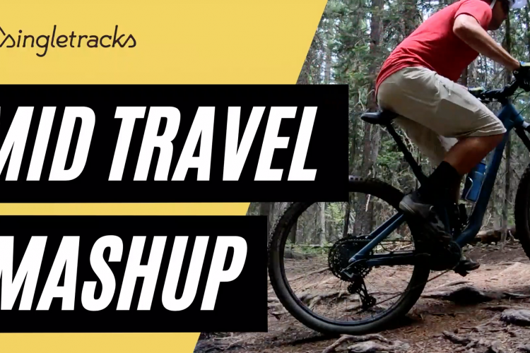 A mountain biker in red and beige rides a blue bike through a forested area with trails, accompanied by bold text that reads "MID TRAVEL MASHUP" on a yellow background.