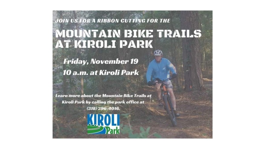 Image of a promotional flyer for the ribbon cutting ceremony of the mountain bike trails at Kiroli Park. The flyer includes details about the event scheduled for Friday, November 19, at 10 a.m., and features a person riding a mountain bike on a trail surrounded by trees. The park