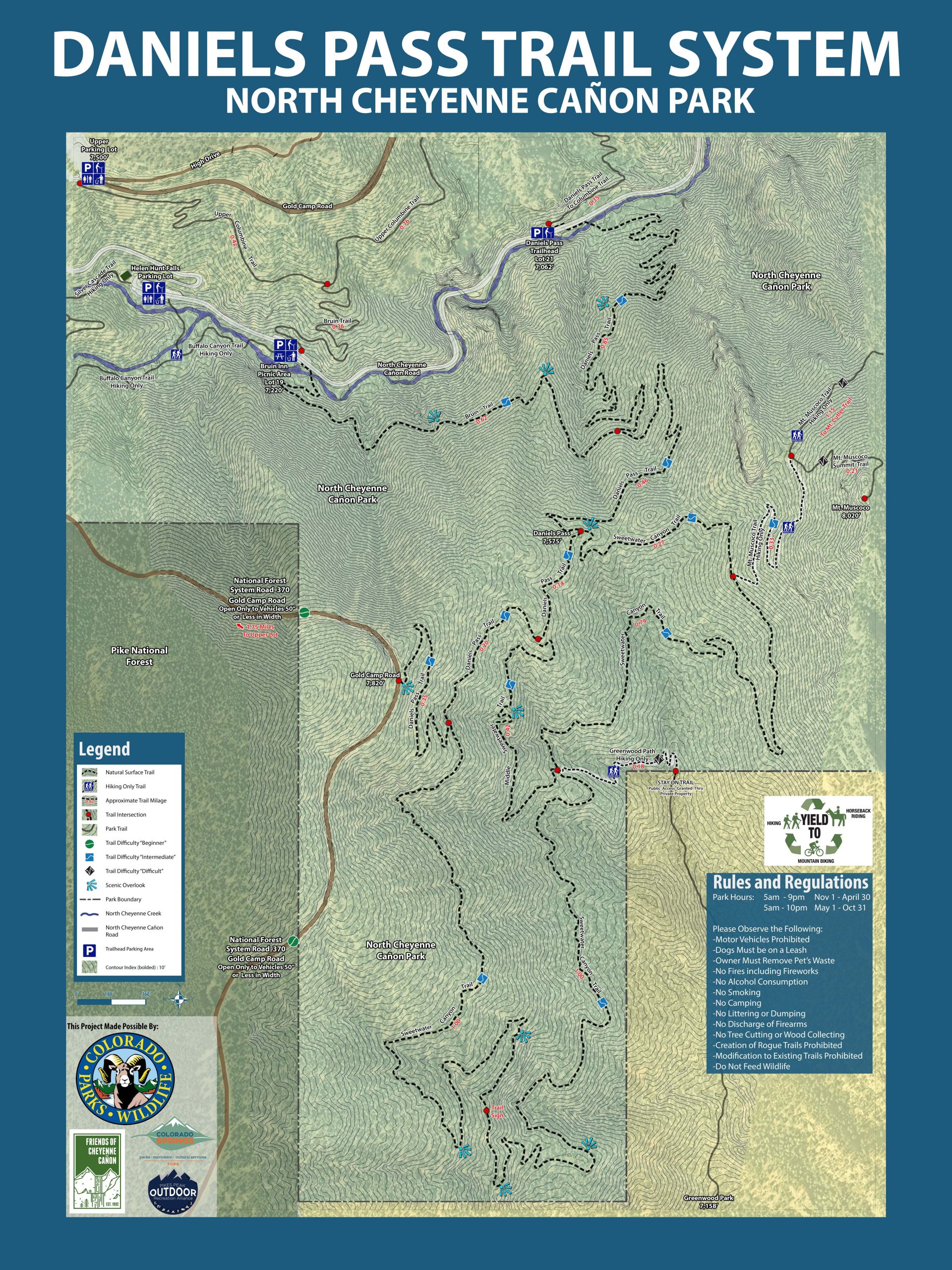 Map of the Daniels Pass Trail System in North Cheyenne Canyon Park, featuring trail routes, parking areas, and regulations. The legend identifies various trail types, including surface and trails for biking and horseback riding. Inset maps highlight nearby areas and park rules, including prohibited activities. Sweetwater Canyon Trail mountain bike trail.