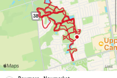 A map showing a cycling route with a red line tracing the path taken. The route is located in Newmarket, with notable landmarks and roads labeled. The date and time of the ride are indicated at the bottom, along with the name "Bowmore." Bowmore (Woodland) Hill's mountain bike trail.
