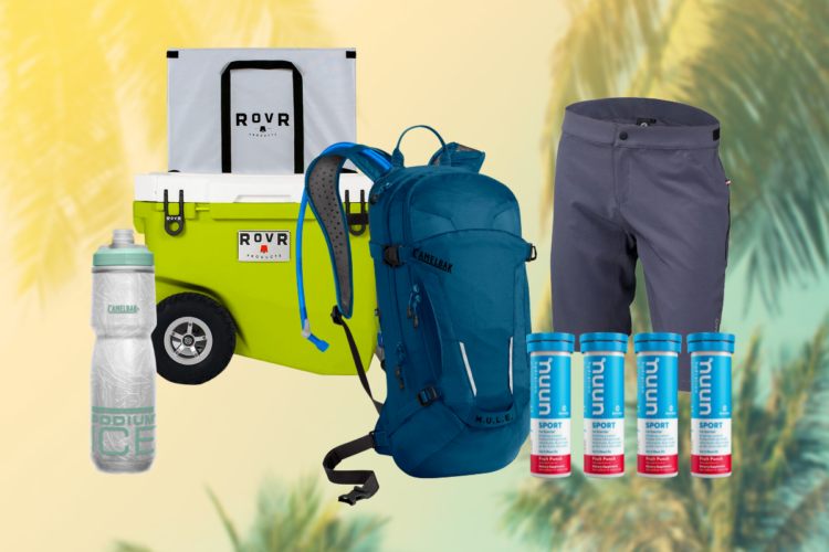 A colorful collection of outdoor gear including a bright green cooler, a blue CamelBak backpack, a silver water bottle, gray shorts, and electrolyte tablets, set against a soft, tropical background.