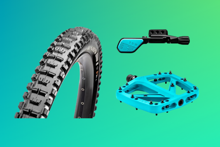A mountain bike tire, a blue pedal, and a dropper post lever are displayed on a gradient green background, showcasing bicycle components for cycling enthusiasts.
