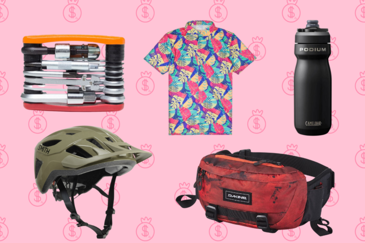 A flat lay image featuring a multi-tool, a colorful tropical print shirt, a black CamelBak Podium water bottle, a light green bicycle helmet, and a red Dakine waist bag, all set against a pink background with dollar sign patterns.