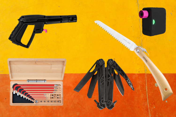 Alt text: A collection of various tools arranged on a colorful background. The tools include a black spray gun, a wooden-handled saw, a multi-tool, and a set of red hex keys housed in a wooden box, alongside a compact device with a pink and black design.