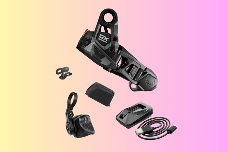 Image of a SRAM GX Eagle rear derailleur along with various accessories, including a battery, charging dock, and cables, set against a gradient pink and yellow background.
