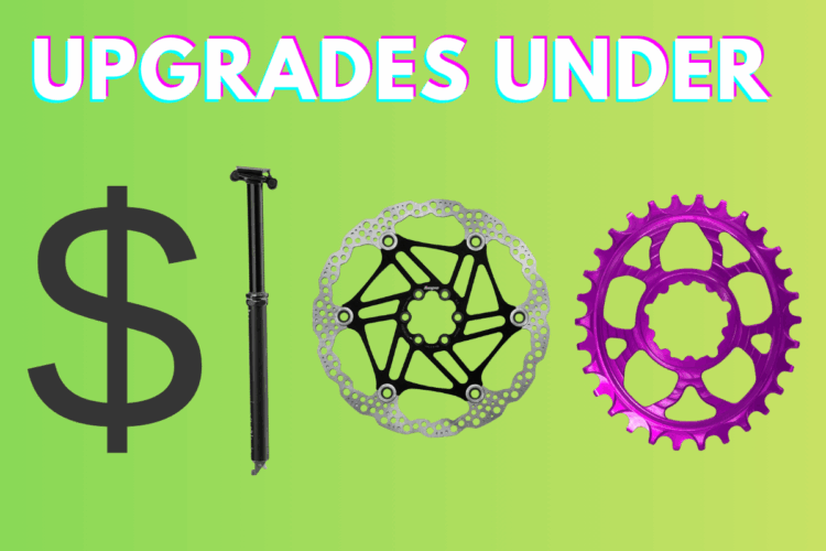 Image depicting bike upgrades under $100, featuring a large dollar sign, a black dropper post, a silver brake rotor, and a vibrant purple chainring, all set against a bright green gradient background. The top text reads "UPGRADES UNDER."