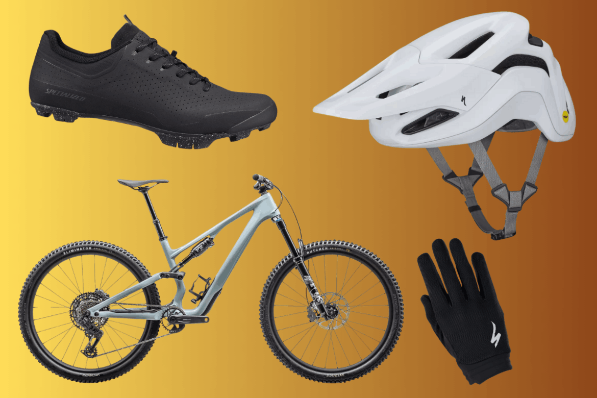 A collection of mountain biking gear featuring a pair of black cycling shoes, a white helmet, a silver mountain bike frame, and a pair of black gloves, all set against a gradient orange background.