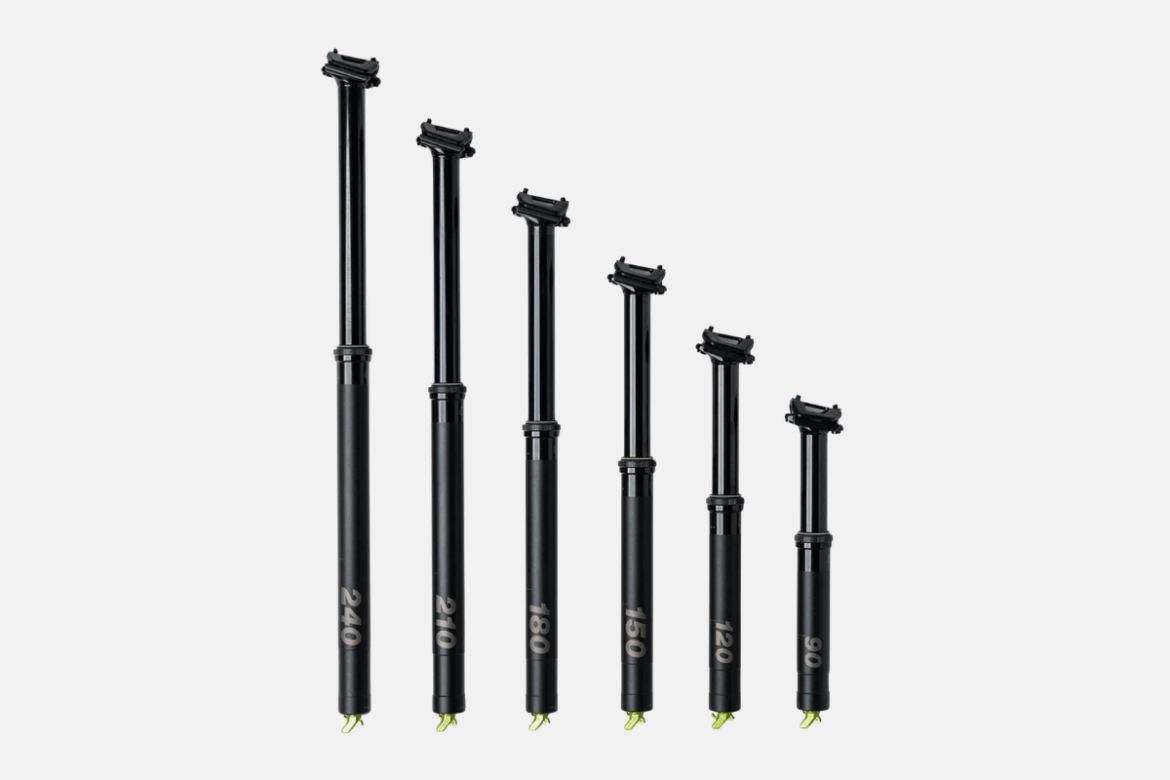 A lineup of six black bicycle dropper seat posts of various lengths, ranging from 90mm to 240mm, with measurement markings displayed on the side. Each post has a similar design featuring a glossy finish and a top mount for secure attachment to the bike frame.