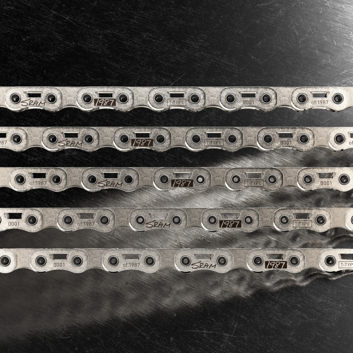 An image featuring multiple SRAM bicycle chains from 1987 displayed in a stacked arrangement. Each chain segment is metallic with engraved markings indicating "SRAM" and "1987," showcasing the vintage design and craftsmanship of bicycle components.