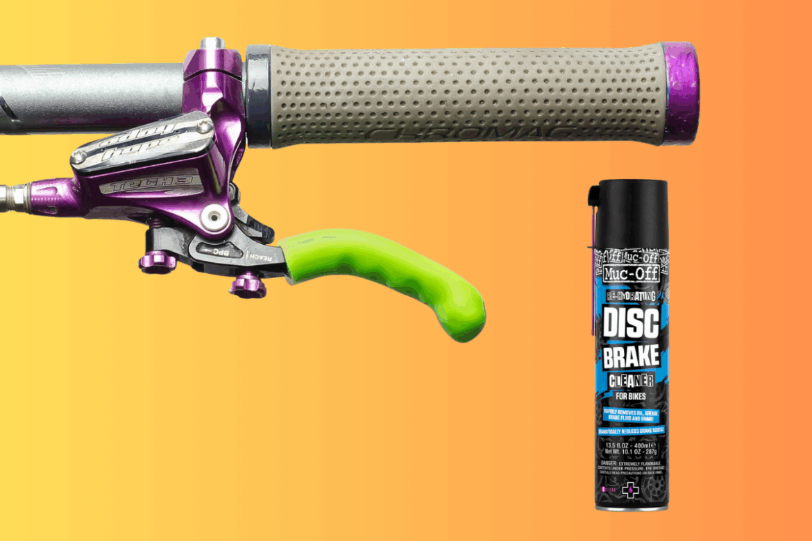 Image showing a bicycle brake handle with a green rubber grip, a purple lever, and a textured gray grip. Next to it is a can of Muc-Off disc brake cleaner for bikes, prominently displaying its label against a gradient orange background.