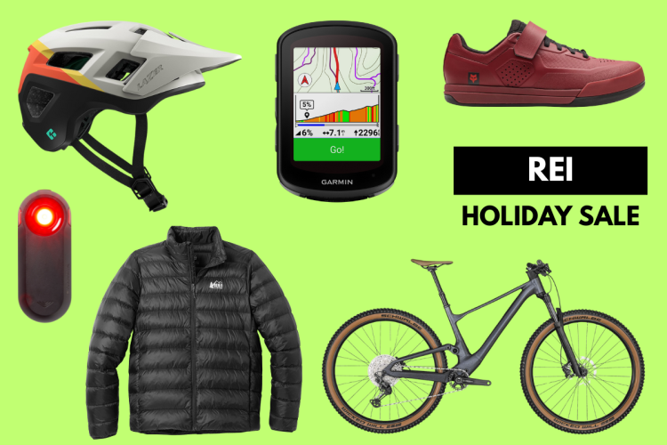A collection of outdoor gear displayed on a bright green background, featuring a white and orange mountain bike helmet, a Garmin GPS device with a map display, red biking shoes, a black insulated jacket, a red bike light, and a mountain bicycle. The image promotes an REI holiday sale.