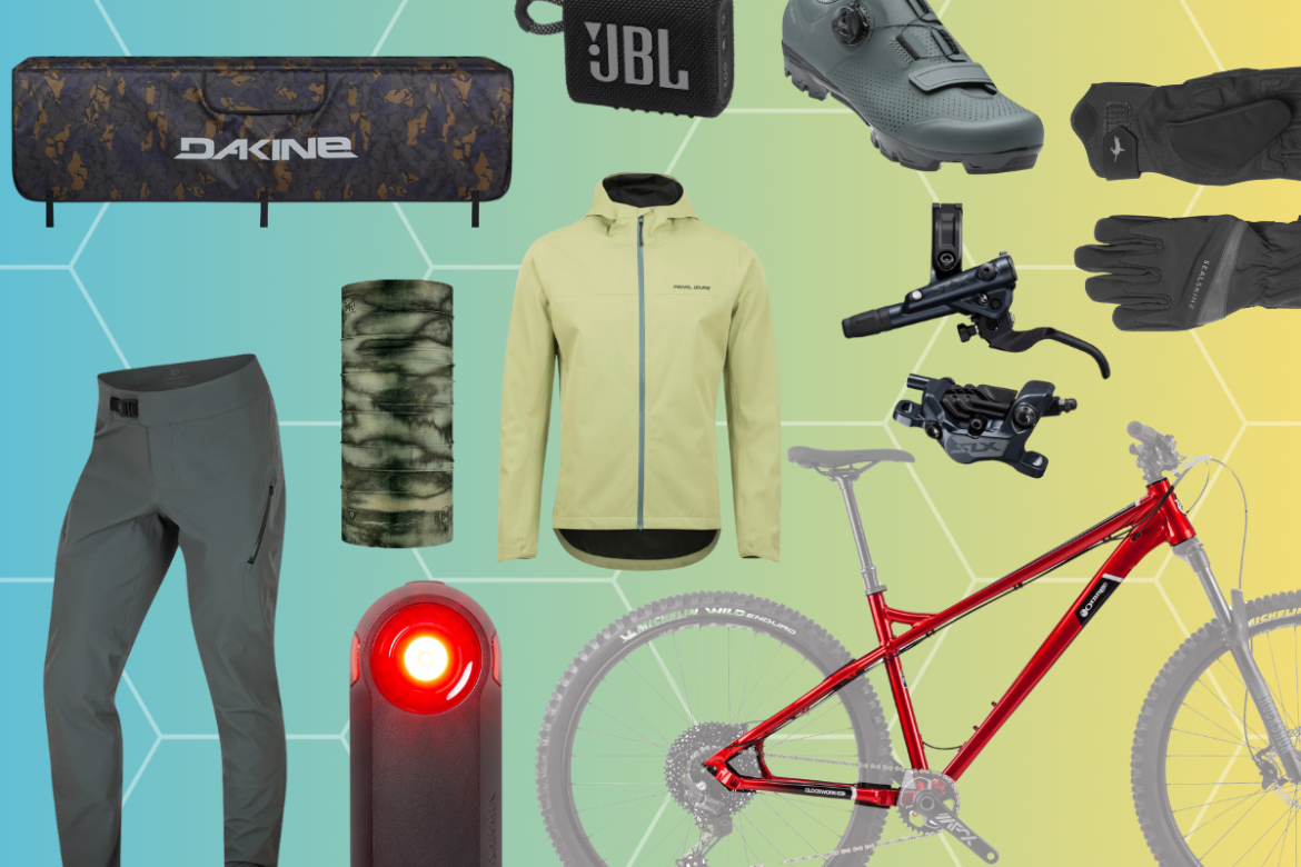 A collection of outdoor sports gear featuring a red mountain bike frame, a set of gray riding pants, a yellow jacket, a camouflage neck gaiter, black gloves, a bike light, a JBL portable speaker, cycling shoes, and bike components including a brake lever and caliper, all arranged against a colorful hexagonal background.