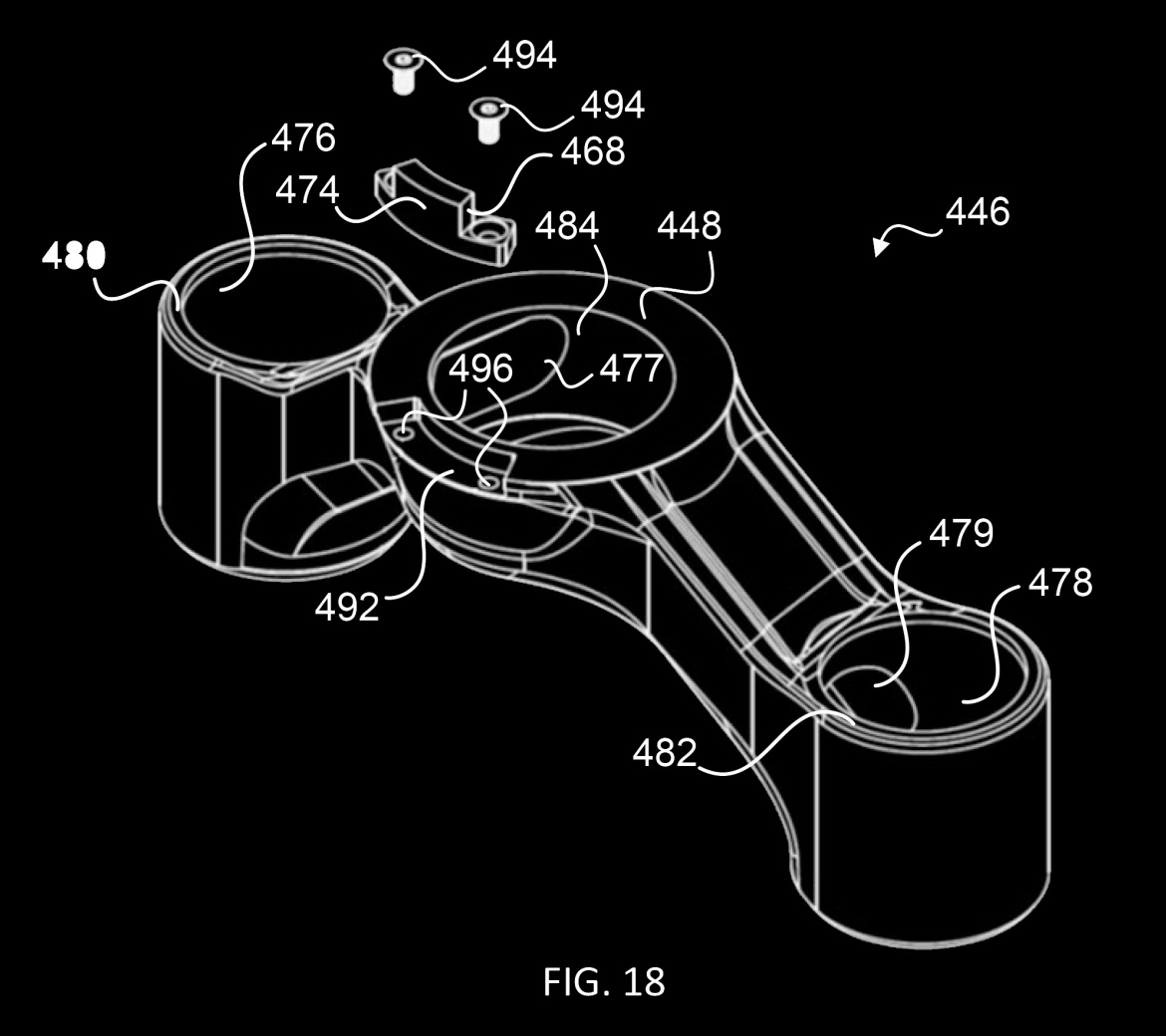 A technical drawing of a mechanical part showing various labeled components, including screws and structural features. The image is rendered in a white line on a black background, highlighting the design and layout of the piece. Numerical labels identify different sections and elements of the part.