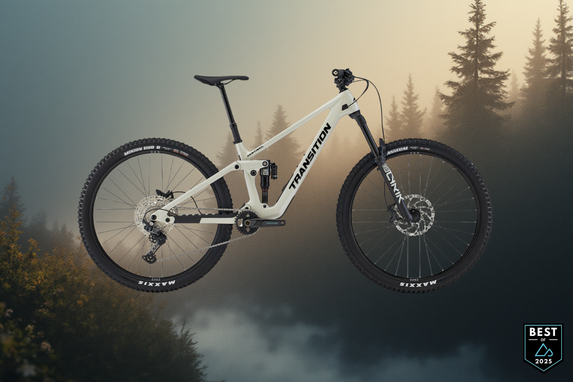 Image of a mountain bike against a misty forest background. The bike features a white frame with black components and thick tires, showcasing a modern design suited for off-road riding. In the corner, a badge reads "Best of 2025."
