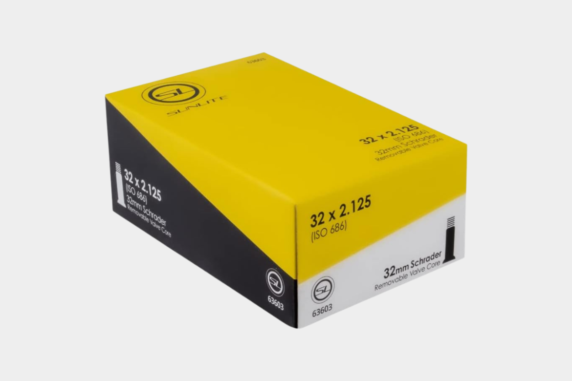 Box of Sunlite bicycle inner tubes, labeled with dimensions 32 x 2.125, featuring details on ISO standards and a removable Schrader valve core, with a prominent yellow and black design.