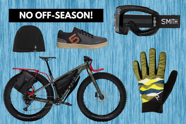 A flat lay composition showcasing outdoor gear for mountain biking, including a fat tire bike, a black beanie, a pair of Five Ten biking shoes, Smith goggles, and colorful gloves. The background features a blue texture with the text "NO OFF-SEASON!" prominently displayed.