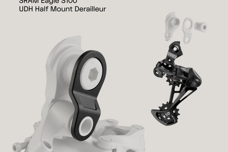 Illustration of the SRAM Eagle S100 UDH Half Mount Derailleur, showcasing the black derailleur and components, with a gray background. The image highlights the design and functionality of the derailleur, ideal for bicycle enthusiasts and mechanics.