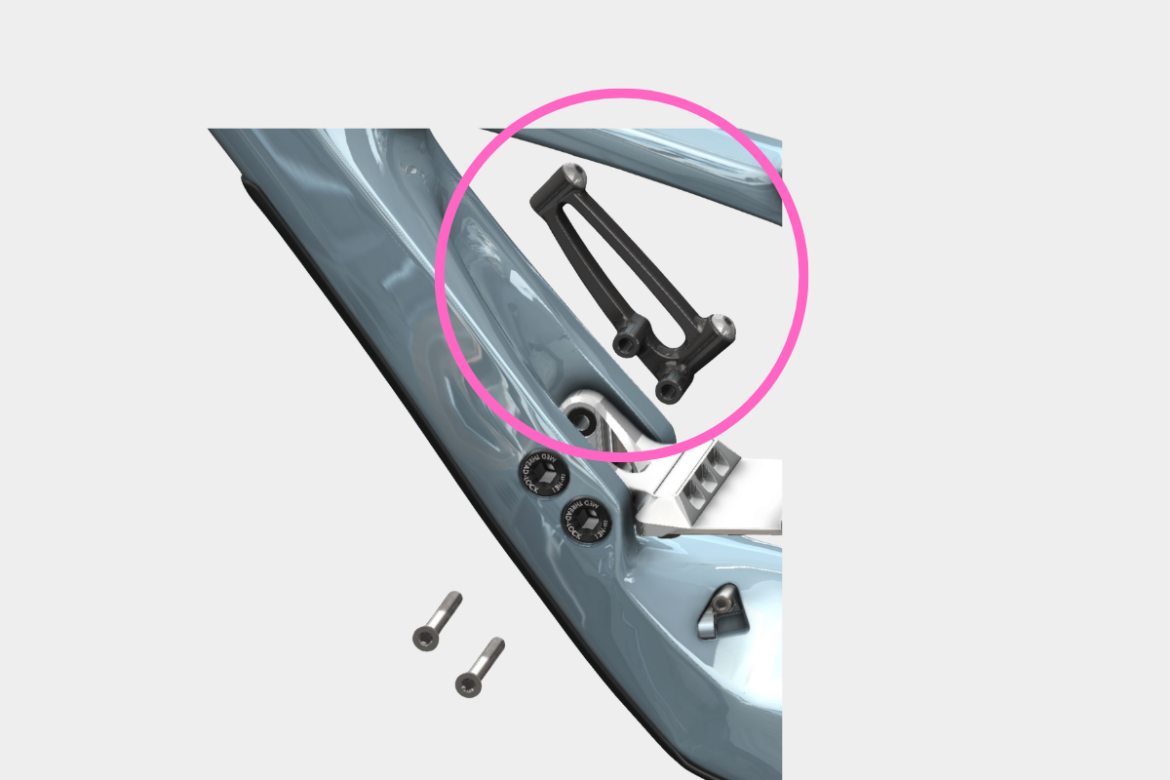 Close-up image of a black, L-shaped bicycle component with two attachment points, highlighted in pink. The component is positioned on a sleek, light blue bicycle frame. Nearby, there are two silver screws visible.
