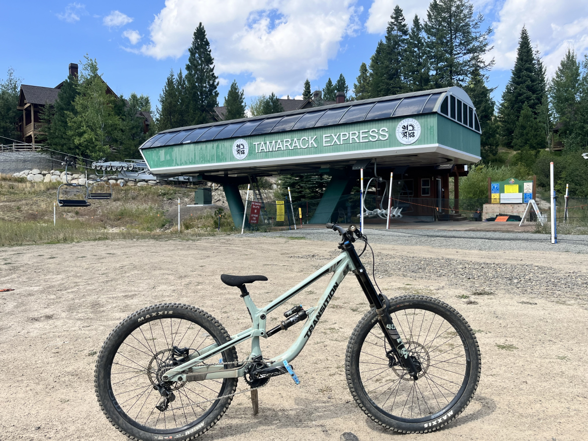 A transition downhill mountain bike infront of the Tamarack Express lift at Tamarack Resort