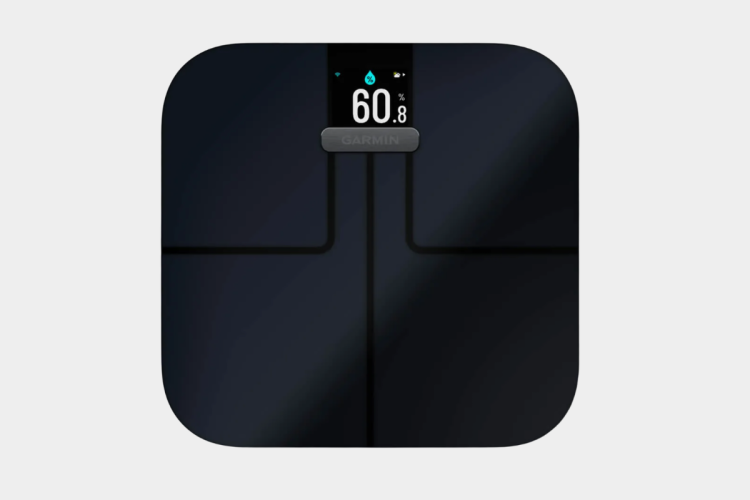 A sleek black digital scale featuring a display that shows weight and body composition metrics, including a percentage for body fat or hydration. The surface is smooth with a modern design, and the brand name "Garmin" is prominently displayed.