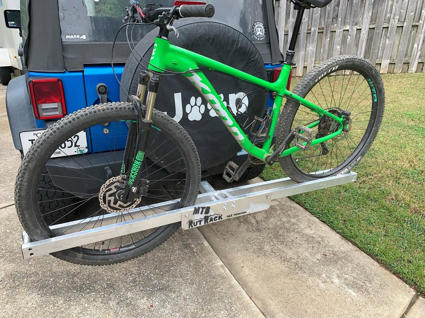 The Rut Rack is a hitch rack for hauling bikes with zero straps or moving parts