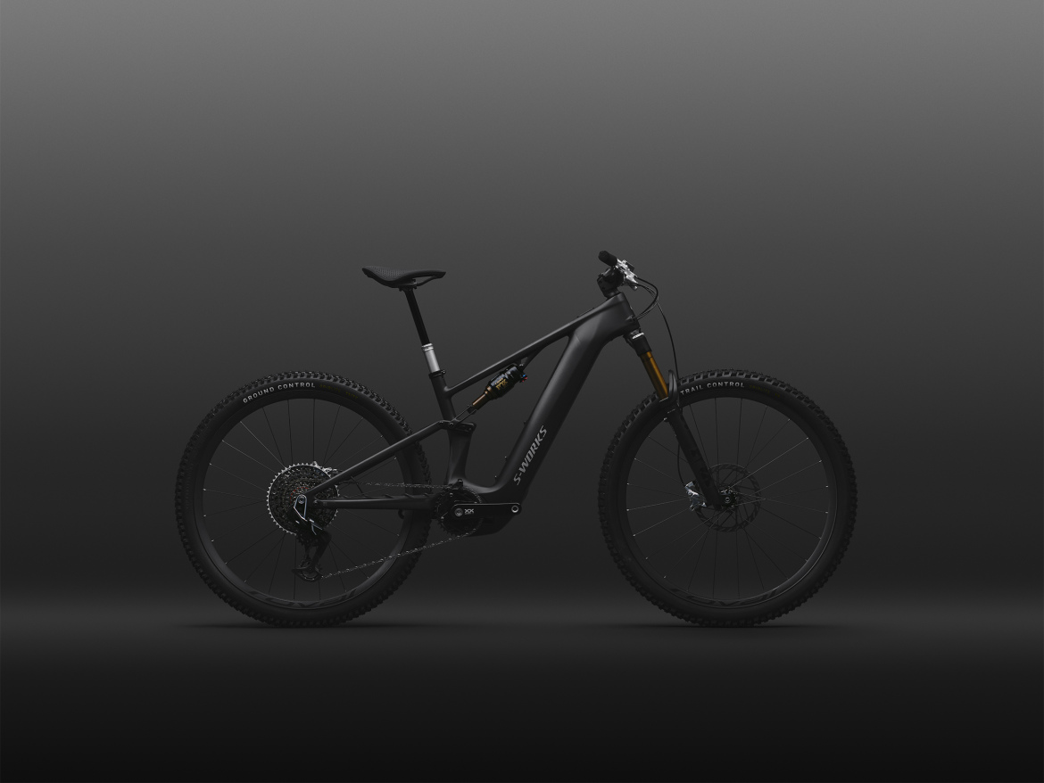 Electric mountain bike in a sleek black finish, showcased against a dark background, highlighting its modern design and off-road capabilities.