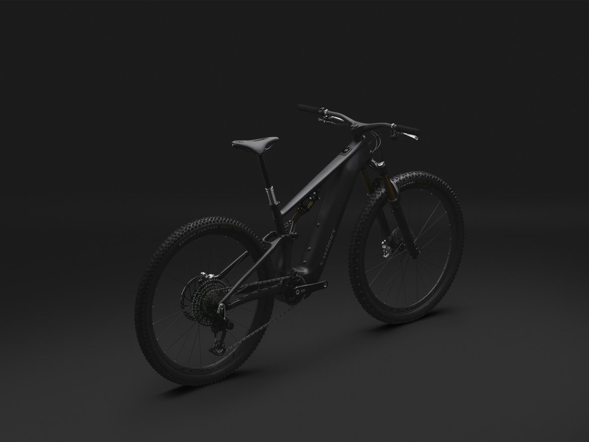 A sleek, modern mountain bike displayed on a dark background, highlighting its matte black frame and prominent components such as the suspension and wheelset. The bike is angled slightly to showcase its design and features.