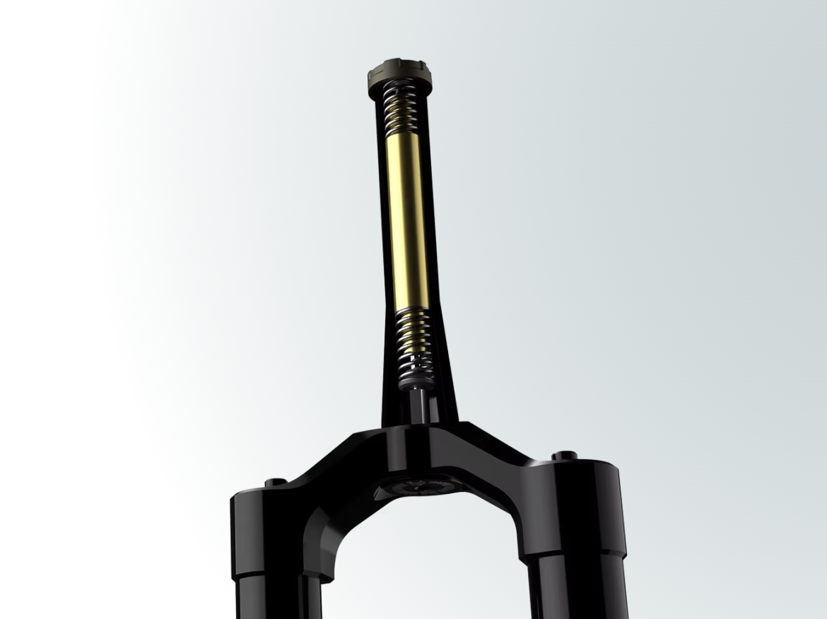 Detailed view of a bicycle suspension fork with a black finish, highlighting the internal components including a yellow spring and piston. The fork is positioned vertically on a light gradient background, showcasing its design and functionality.